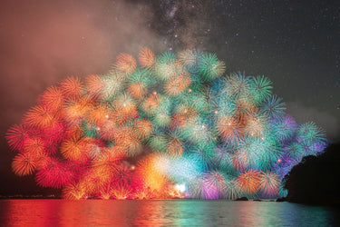 Fireworks and smoke over water